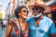 Happy senior black couple having fun walking on city street - Two older tourists enjoying together weekend summer vacation - Life style, tourism and romantic moments concept