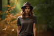 © VISUAL BACKGROUND - Woman wearing hat and brown shirt is standing in forest