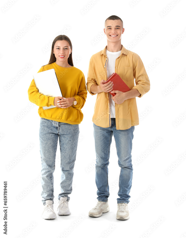 Happy students with books and laptop isolated on white background