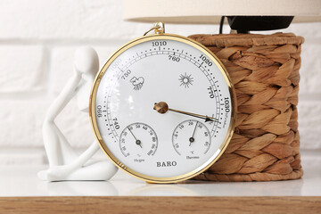 Wall Mural - Aneroid barometer on table in room, closeup