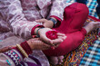 © GraphicGearsCom - Indian bride and groom performing puja. Hindu marriage ritual in marriage function