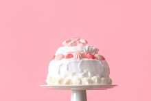 Dessert Stand With Tasty Birthday Cake On Pink Background