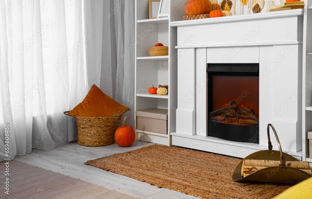 Interior of living room with pumpkins and fireplace