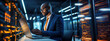 © Yeti Studio - Man working on a laptop at the data center. Digital world in male professional hands. Copy space