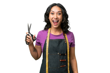 Wall Mural - Young seamstress argentinian woman over isolated background with surprise facial expression