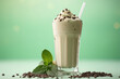 Delicious milkshake with chocolate chips, perfect for refreshing treat on hot day. Great for use in food and beverage related projects.
