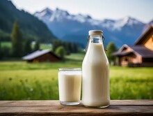 Glass And Bottle Of Fresh Milk Against The Backdrop Of The Village. AI