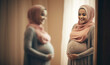 Pregnant muslim woman in hijab embracing her belly and posing over gray background with free space, proud religious muslim woman expecting baby standing at home.
