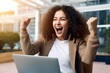 Happy woman feeling winner rejoicing online win got new job opportunity, overjoyed motivated mixed race girl student receives good test results on laptop celebrating admission