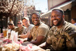 © Garnar - Group of happy african american military men, smiles soldier war veterans on a sunny day in a street cafe sharing memories and talking about service together. Celebrating Remembrance, Independence Day