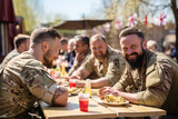 Fototapeta  - Group of happy military men, smiles soldier war veterans on a sunny day in a street cafe sharing memories and talking about service together. Lifestyles and friendship. Celebrating Remembrance Day