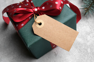 Wall Mural - Blank paper gift tag mockup with christmas box, empty tag mock up with copy space