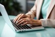© Ivy - Detailed close-up of a business woman's hands working on a laptop keyboard