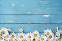 A Bouquet Of A Beautiful White Daisy Arranged On The Left Side, Right Side Of The Blue Wooden Panel Wall, The Blue Background, Generative AI.