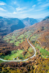 Wall Mural - colorful view of an autumn mountain with peaks, meadows and colorful forests near the canyon of tara