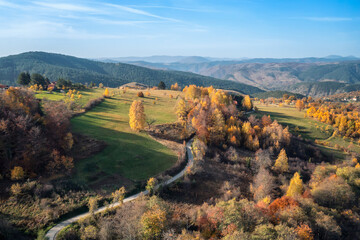 Wall Mural - colorful view of an autumn mountain with peaks, meadows and colorful forests of dinaric alps, near z