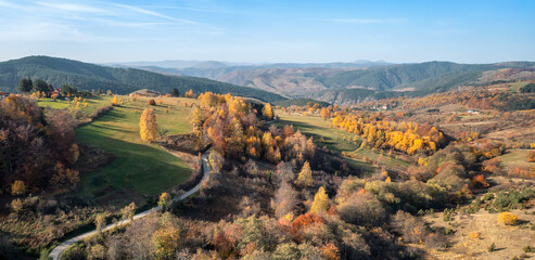 Wall Mural - colorful view of an autumn mountain with peaks, meadows and colorful forests of dinaric alps, near z