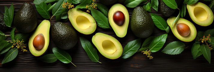 green avocado with leaves, banner top view