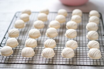 Sticker - macaron shells cooling on a wire rack