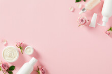 Natural Beauty Products For Body Treatment And Skin Care Concept. Flat Lay White Cosmetic Bottles, Jars Of Moisturizer Cream, Rose Buds And Petal On Light Pink Background.