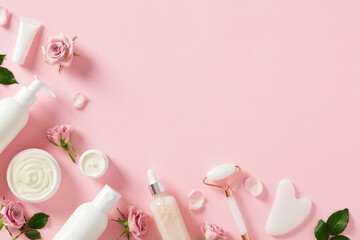 Wall Mural - flat lay composition with cosmetics packages, jars of cream, serum bottles, gua sha, face roller wit