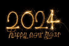 Happy New Year 2024. Sparkling Burning Text Happy New Year 2024 Isolated On Black Background.