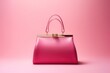 pink woman hand bag isolated on bright background