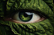 Green large leaf covering human eye