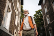 © Halfpoint - Senior man on the street. Elderly cool man listening to music outdoors, having fun. Concept of old man young at heart.