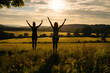 © AIproduction - Graceful Women Practicing Yoga in a Meadow