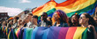 Group of people with rainbow flags and banners during Gay Pride event