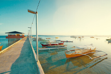 Wall Mural - Beautiful seascape with pier and fishing boat. Siargao, Philippines.