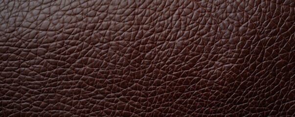 Closeup of a deep chocolate brown Harness Leather texture, highlighting a sy and rugged look. The leather has a prominent grain pattern and visible imperfections.