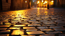 Closeup of a wellpreserved cobblestone alley, with smooth and polished stones reflecting the warm glow of street lights.