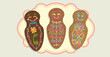 Guaguas de pan - Bread doll decorated with color lines in Spanish language - Top view of 3 different traditional Ecuadorian decorated breads for the day of the dead on a yellow oval tablecloth