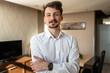 © Miljan Živković - Portrait of young adult caucasian man in apartment wear white shirt