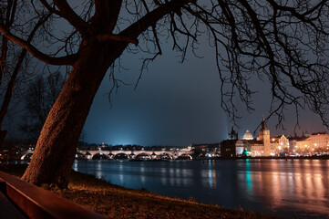 Wall Mural - Prague, view of the Lesser Bridge Tower of Charles Bridge (Karluv Most) at night, Czech Republic.