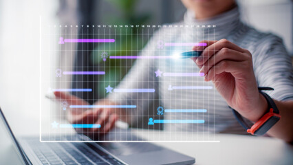 Analyst working with computer in management system to make report with KPI and metrics connected to database. corporate strategy for finance, operations, sales, marketing.Project management concept.