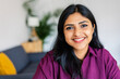 © Xavier Lorenzo - Closeup portrait of young indian woman smile at camera relaxing at home. Diversity and people concept