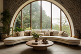 Fototapeta  - Contemporary country sitting room with large half round sofa and cushions with solid wood round coffee table against a large arched window set in natural brickwork tiled floor interior room design