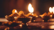 Diwali diya or dal in bowl with diya or oil lamp over moody background. selective focus