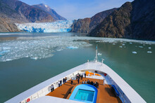 Bow Of A Cruise Ship Facing The South Sawyer Glacier At The End Of Tracy Arm Fjord In Southeast Alaska, USA - Coastal Glacier In The Pacific Ocean