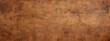 © pham - A weathered and aged brown wall with visible cracks and imperfections
