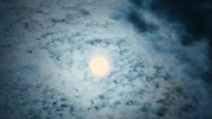 Wall Mural - full moon with clouds scattered by wind in mid autumn. bright moon moving across the sky covered by 