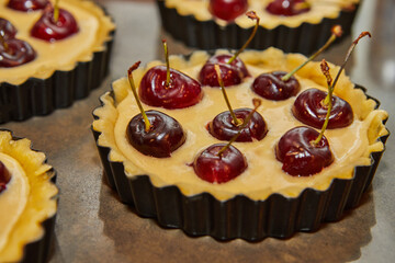 Sticker - Place the cherries in small round molds to make a cherry pie