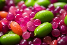 Closeup Of Vibrant Finger Limes - Australian Fruit In Green, Pink, And Red. Refreshing, Zesty, Juicy, Bursting, Small Beads, Sliced, Colorful, Citrusy. Generative AI