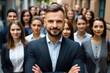 © vefimov - Professional man in suit stands confidently in front of group of people. This image is perfect for business and leadership concepts.