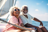 Fototapeta  - An elderly black couple sits in a boat or yacht against the backdrop of the sea. Happy and smiling people. A trip on a sailing yacht. Sea voyage, active recreation. Love and romance of older people.