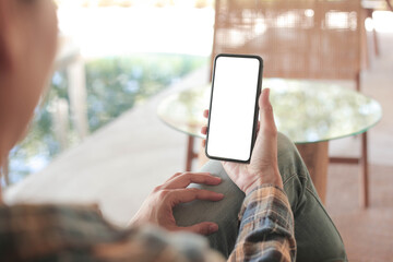 cell phone blank white screen mockup.hand holding texting using mobile on desk at office.background empty space for advertise.work people contact marketing business,technology