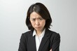 © Maki_Japan - 怒っている日本人の女性シニアビジネスマンのポートレート写真（白背景・サラリーマン・スーツ・上司・起業家・経営者）